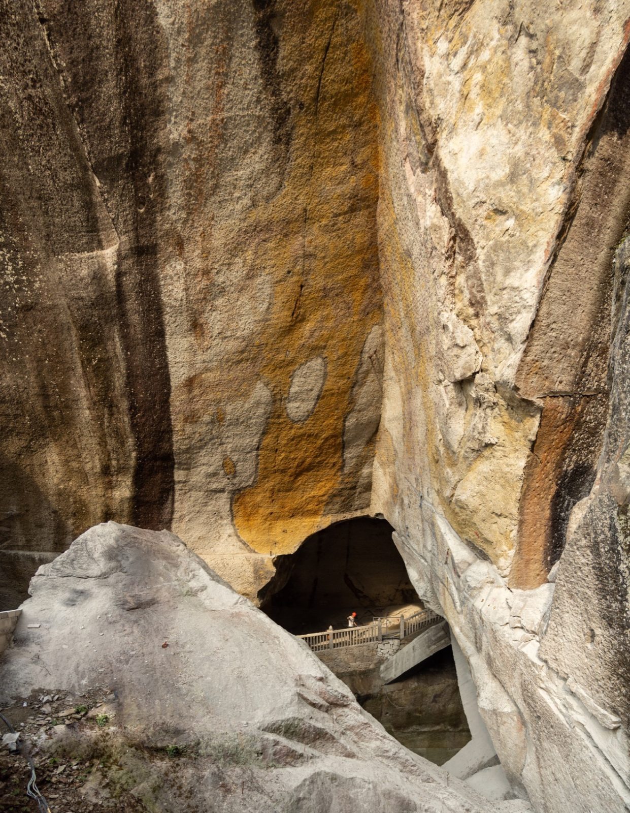 Yellow mineral markings on the excavated rock face