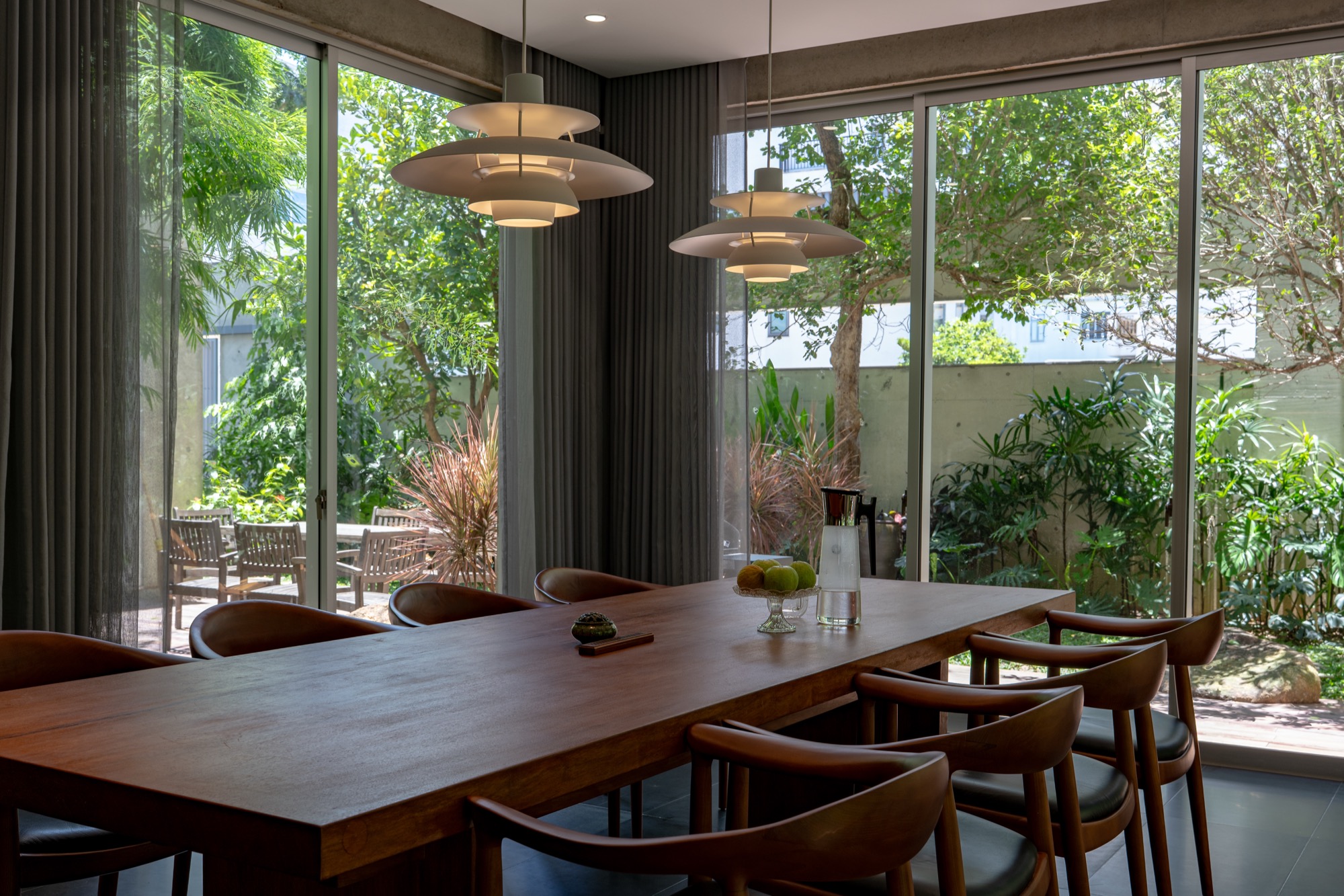 Dining table by full-height glass