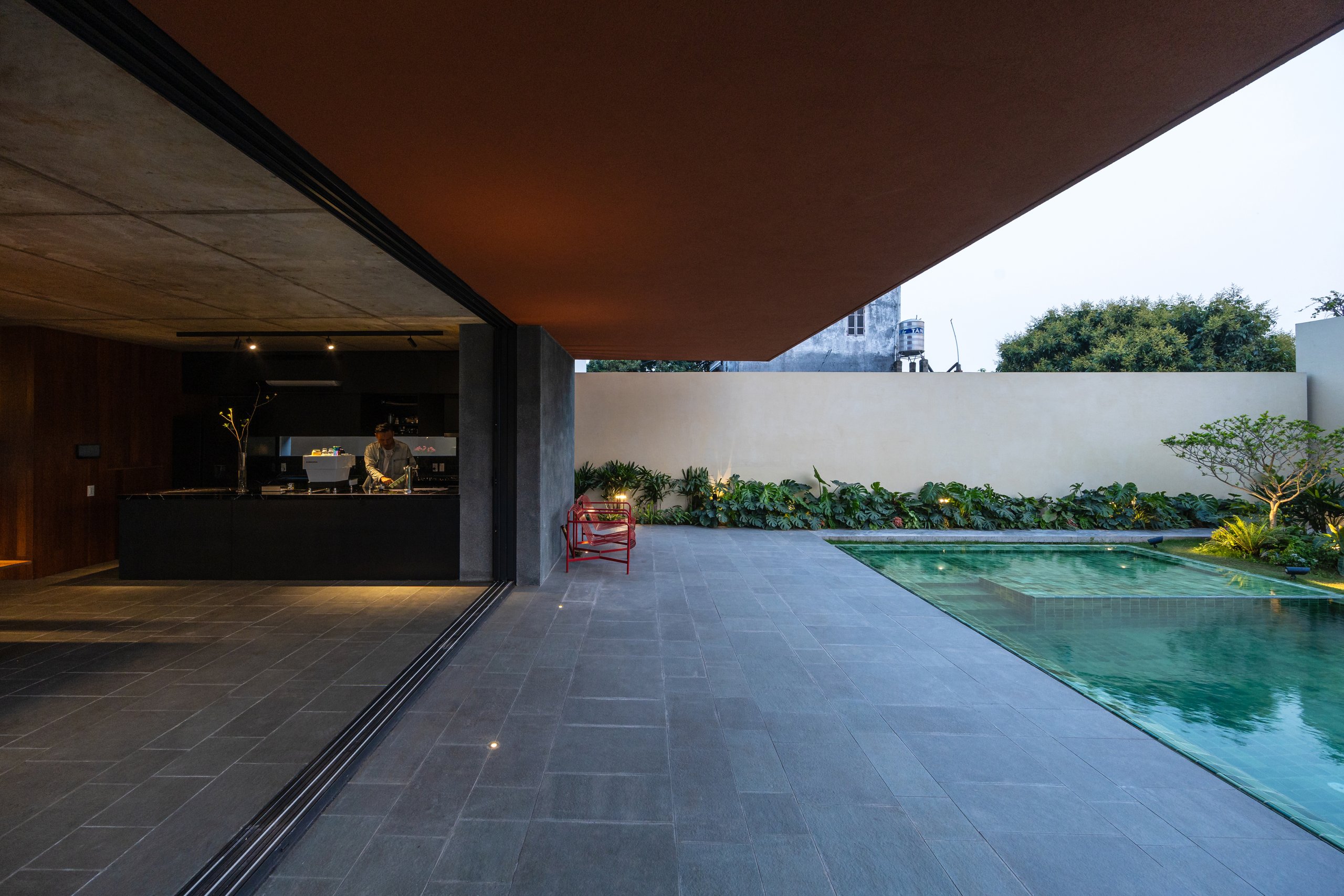 100 Windows by Inrestudio, Hanoi, walled back garden on the ground floor