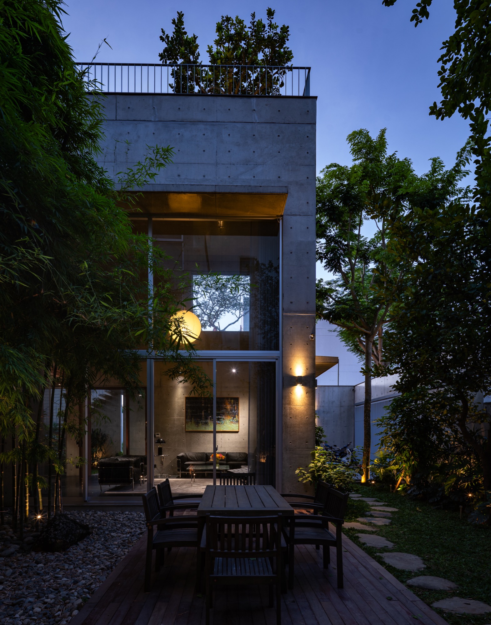 Rear garden and lit interior at dusk