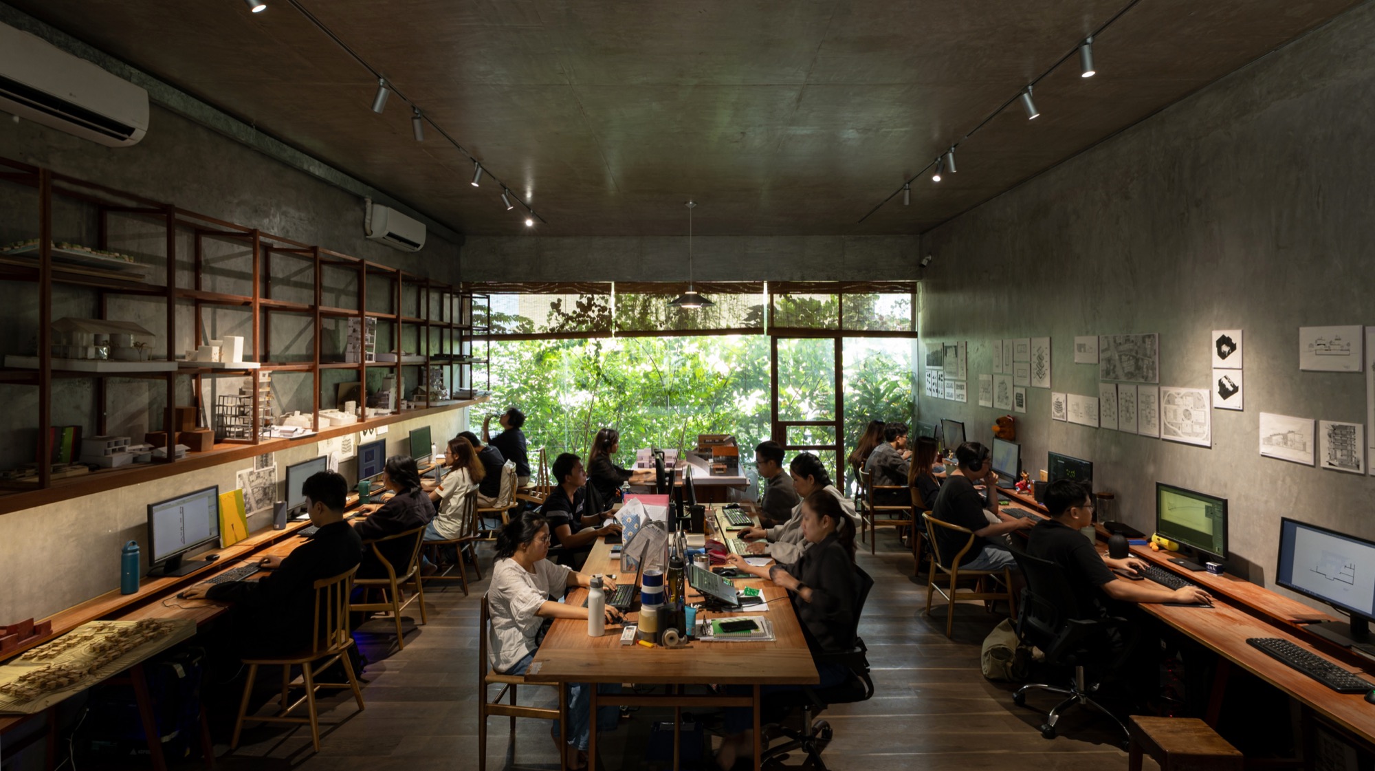 Studio floor with staff at shared desks