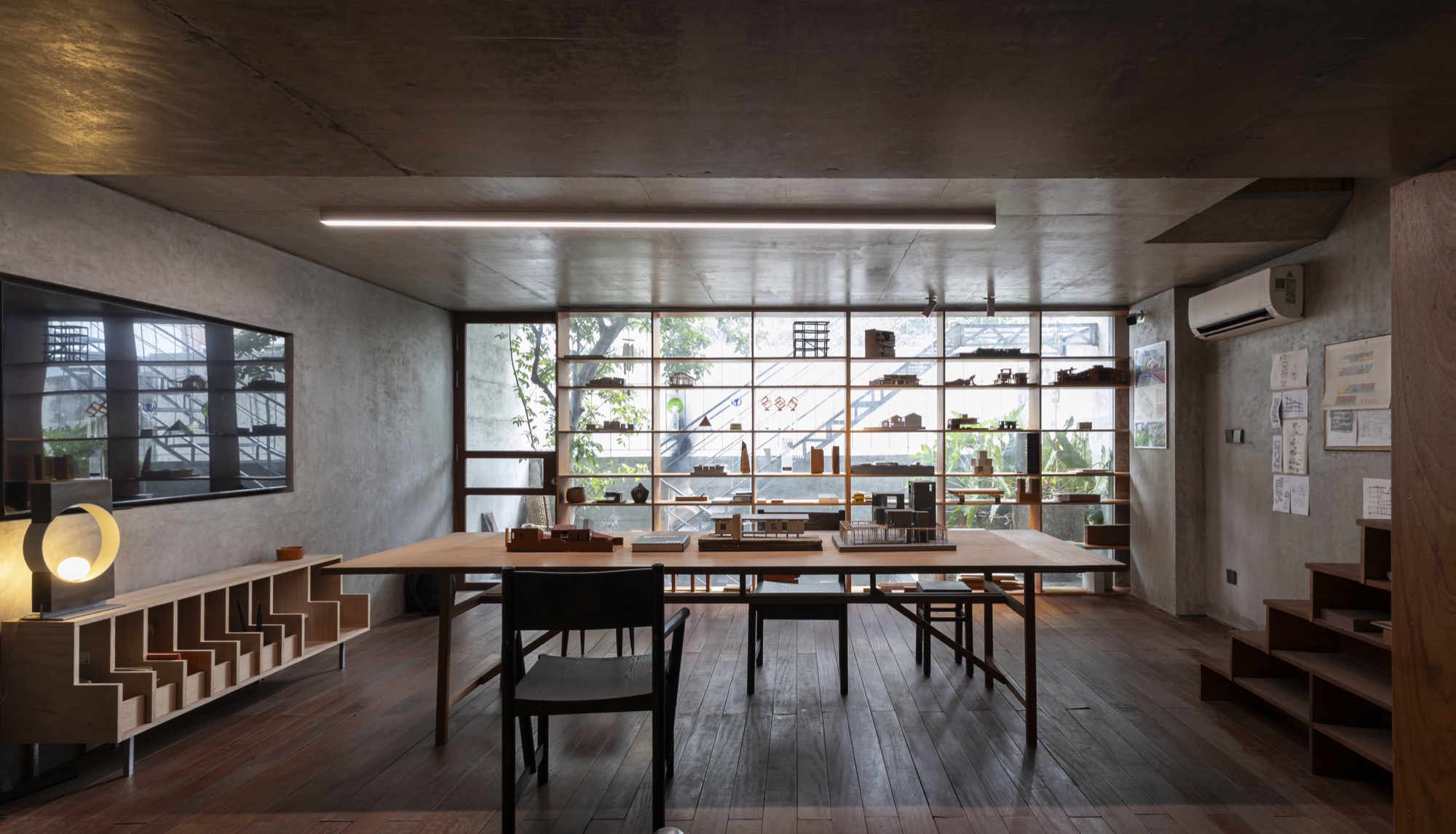 Long work table under the concrete ceiling