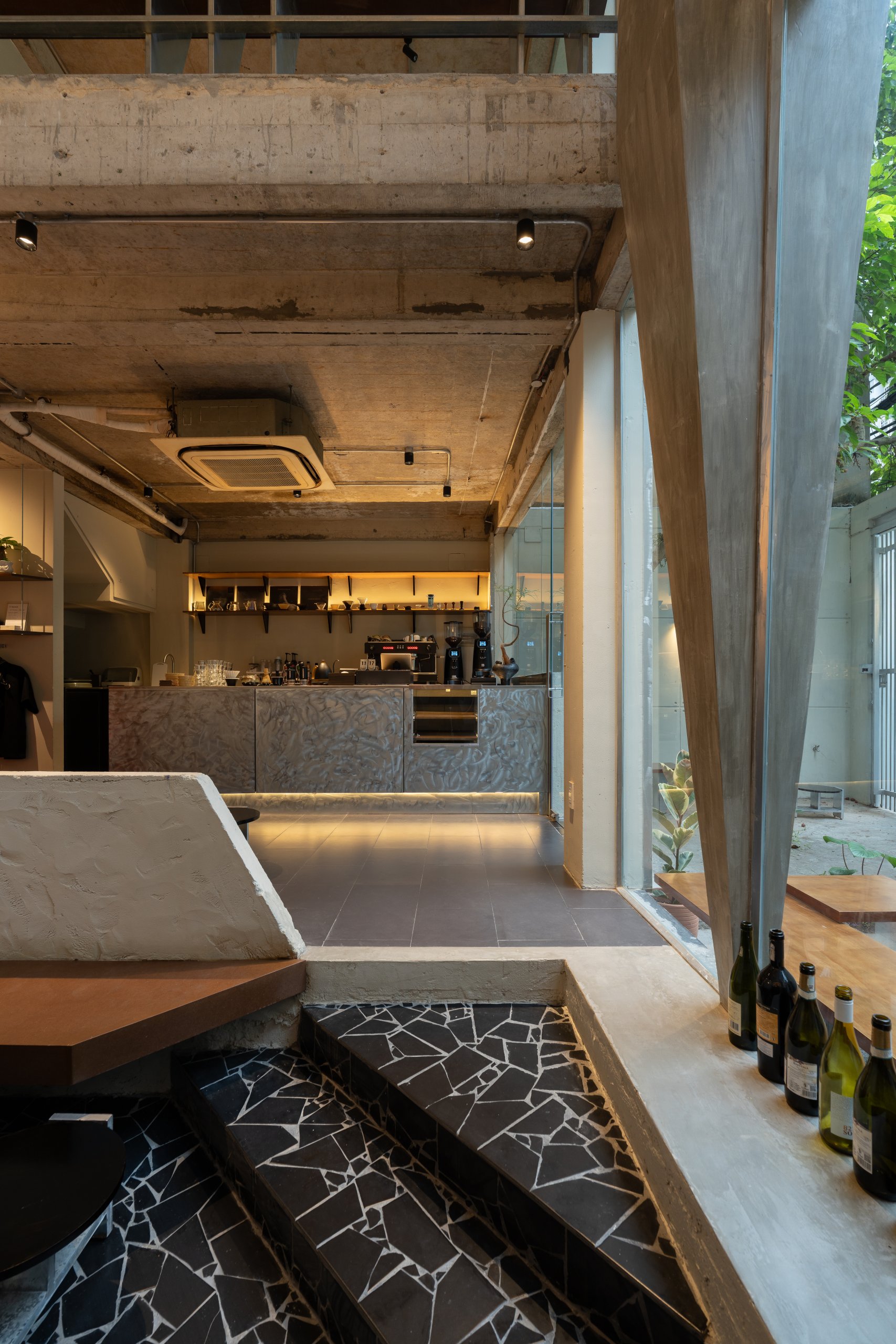 Day1 Cafe by oh.hi studio, interior seen from the stepped seating by the void