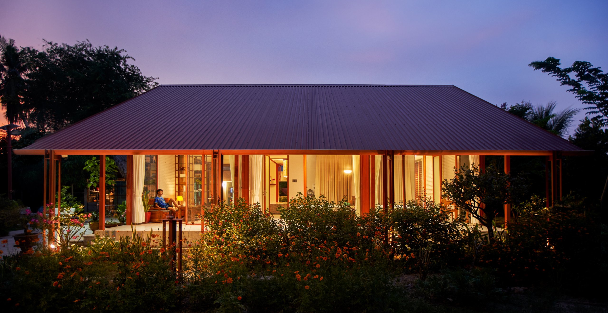 Garden House by aha.studio.arc, Go Quao, An Giang, the house at dusk