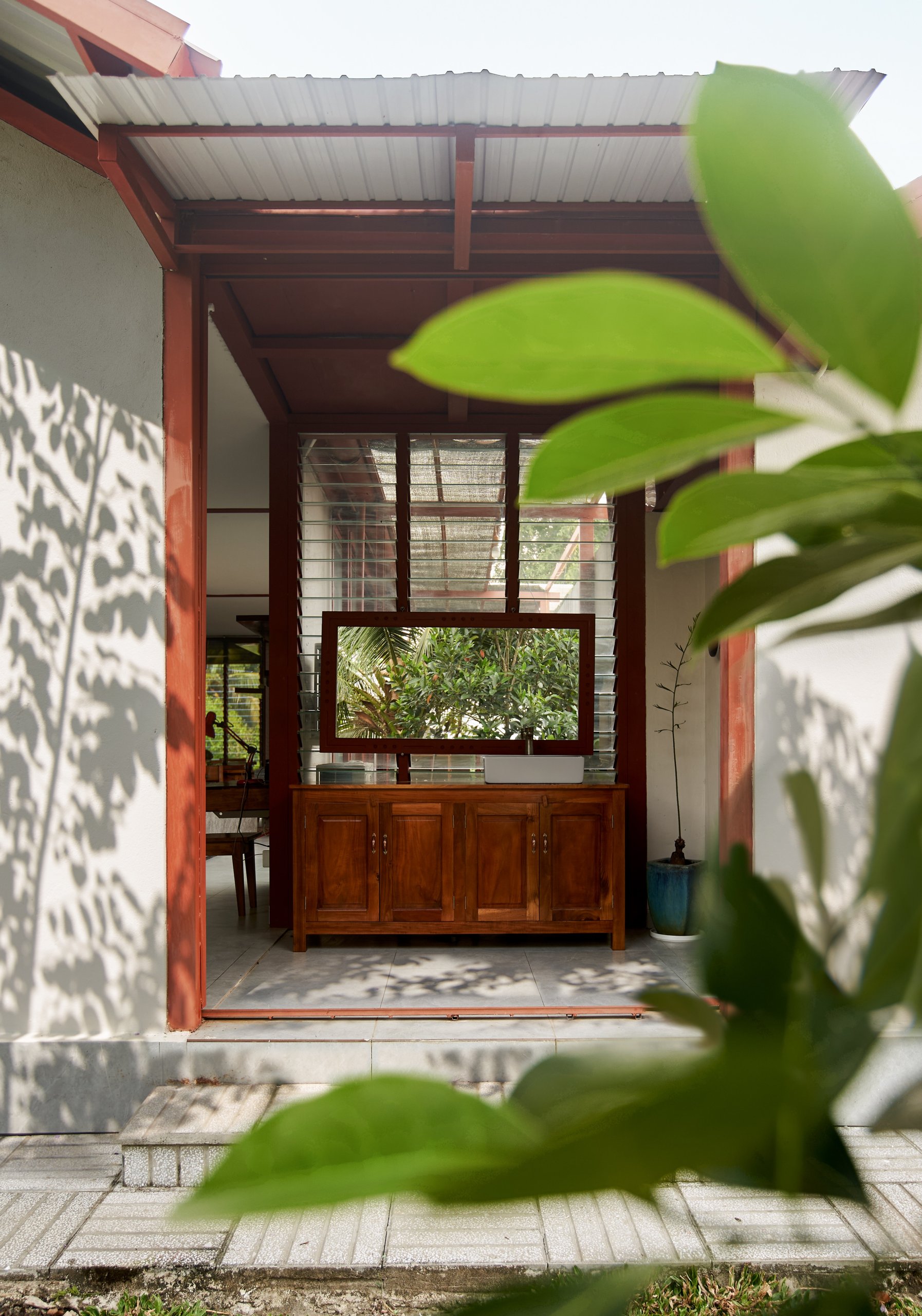 Garden House by aha.studio.arc, Go Quao, An Giang, porch looking into the house