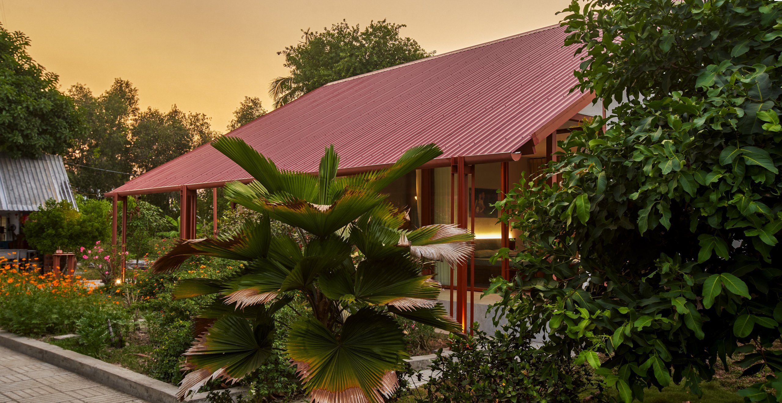 Garden House by aha.studio.arc, Go Quao, An Giang, side view at sunset