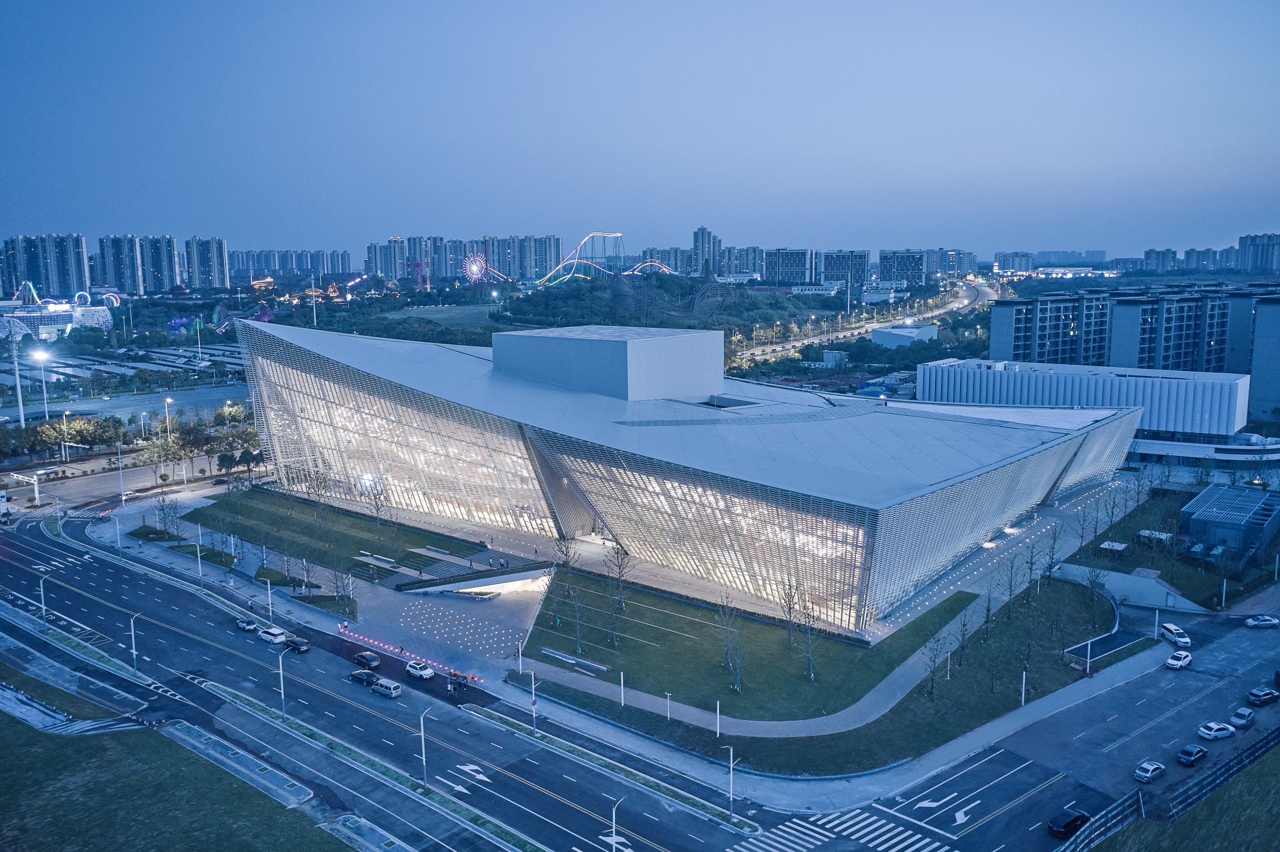 Aerial view of the theatre and its ceramic screen at dusk