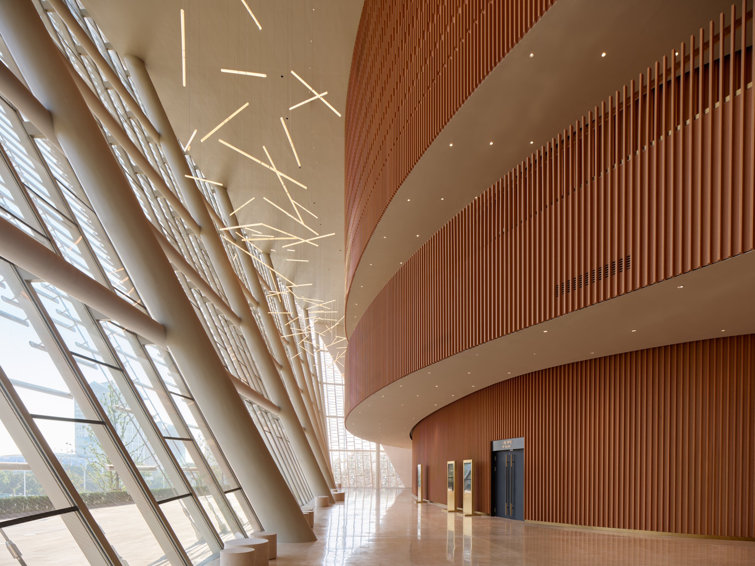 Foyer with bamboo-clad walls and glazed facade